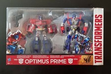 Transformers Age of Extinction Toys R Us Esclusiva Optimus Prime Evolution Nuovo con scatola