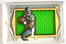 Russell Wilson 2012 Topps Supreme Rookie DIe Cut Relic Card Patch Numbered 28/55. rookie card picture