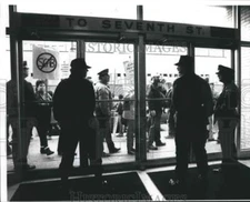 1990 Press Photo Guarding doors to Greyhound terminal downtown Milwaukee.
