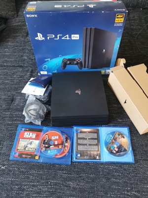 Sony PlayStation 4 Pro  PS4 Jet Black + 1x Ps4 Controller + 2 Spielen