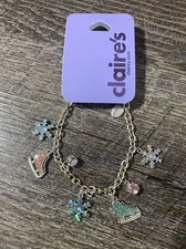 Claire’s ice-skating pink blue snowflake charm bracelet winter jewelry￼
