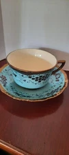 Cumbow Cup and Saucer - turquoise and copper colors