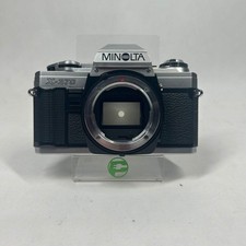 Minolta X-370 SLR Film Camera with two lenses and multiple accessories