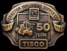 JE23143 VINTAGE 1987 TRACTOR IMPLEMENT SUPPLY CO TISCO 50 YRS BELT BUCKLE