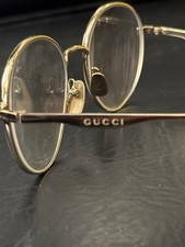 Gucci Round Gold Metal Eyeglass Frames; a modern classic; GG0337O 008
