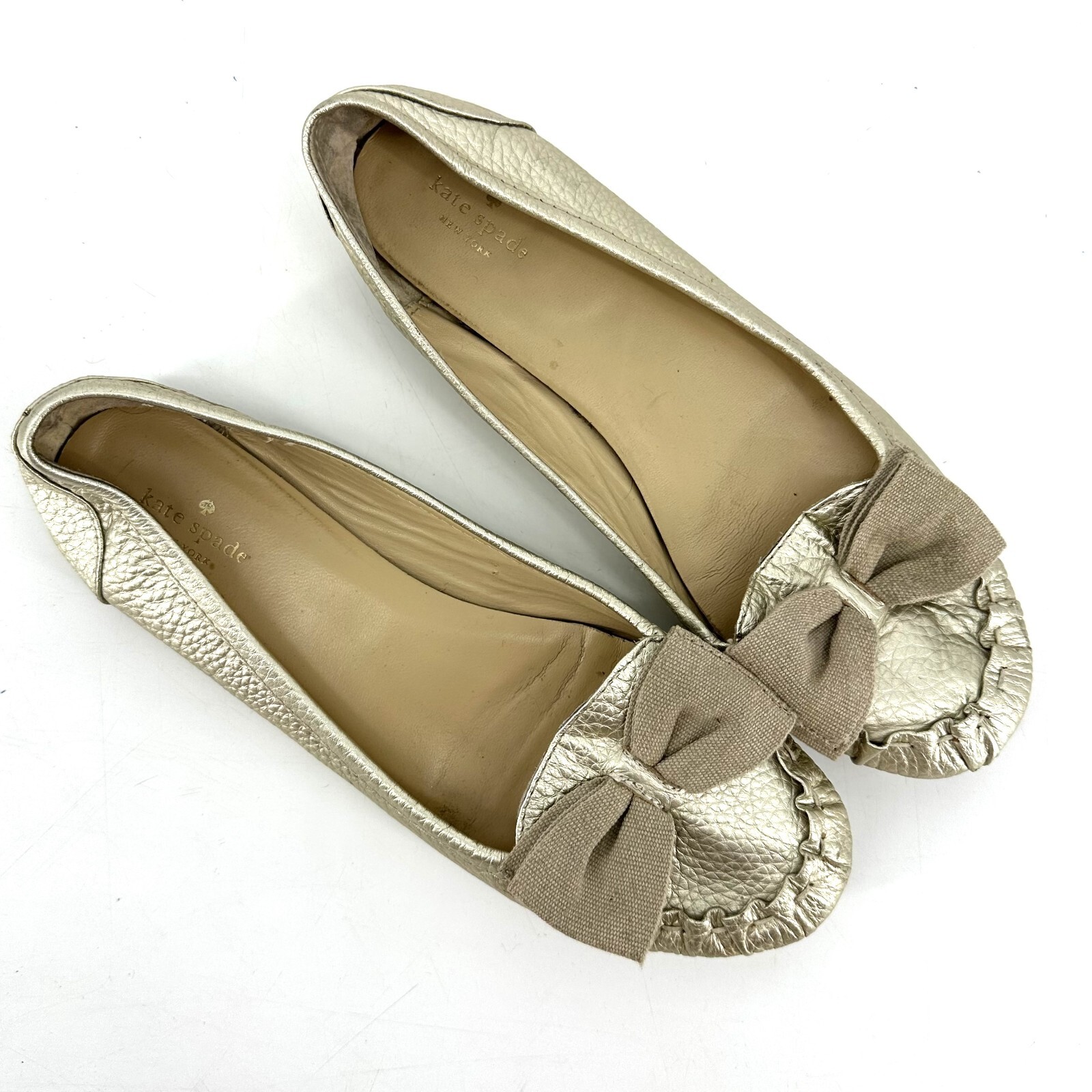Kate Spade Champagne Gold Leather Moccasin Flats with… Gem