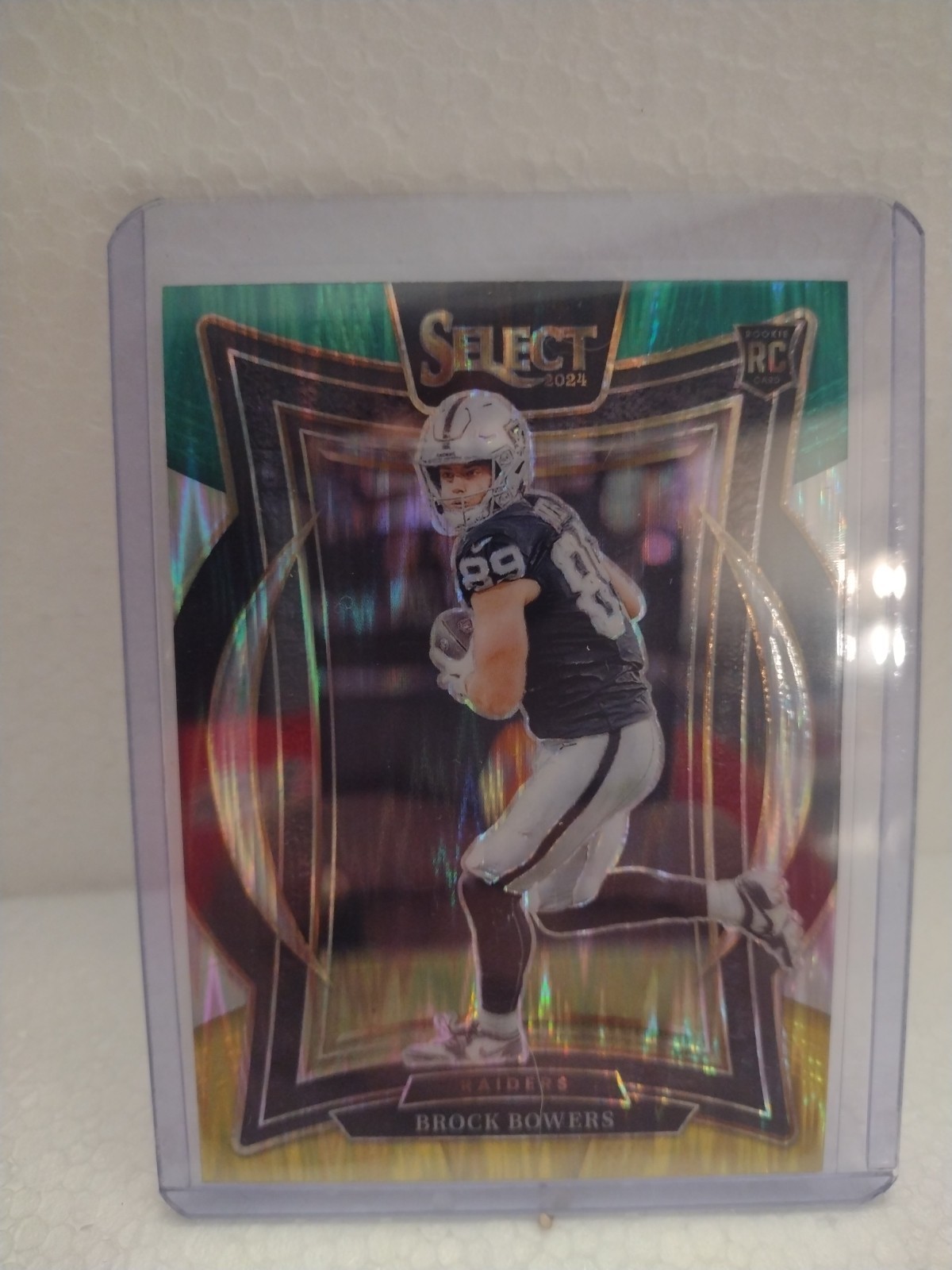 2024 Panini Select - Concourse Brock Bowers #31 Green & Yellow Shock Prizm (RC)