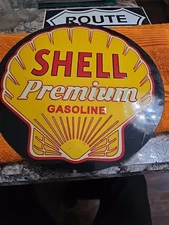 Vintage Embossed Shell premium gasoline sign 10.75"