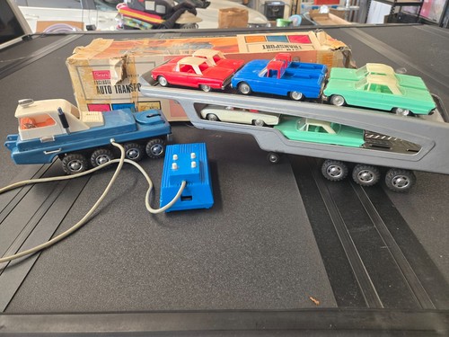 vintage Sears Turnpike car hauler with all 9 cars, made in Japan