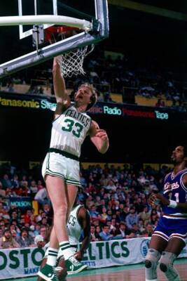 Larry Bird Boston Celtics scores a basket against Lloyd Walton Kan