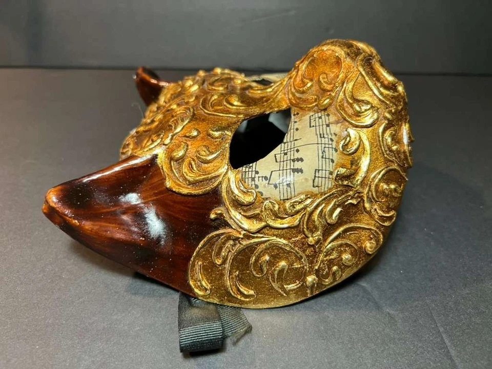 Máscara de carnaval cara gato veneciana dorada y musical Kartaruga Foto 3 de 4
