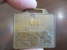 INTERNATIONAL HARVESTER IH BRASS WATCH FOB ORIGINAL CONSTRUCTION EQUIPMENT
