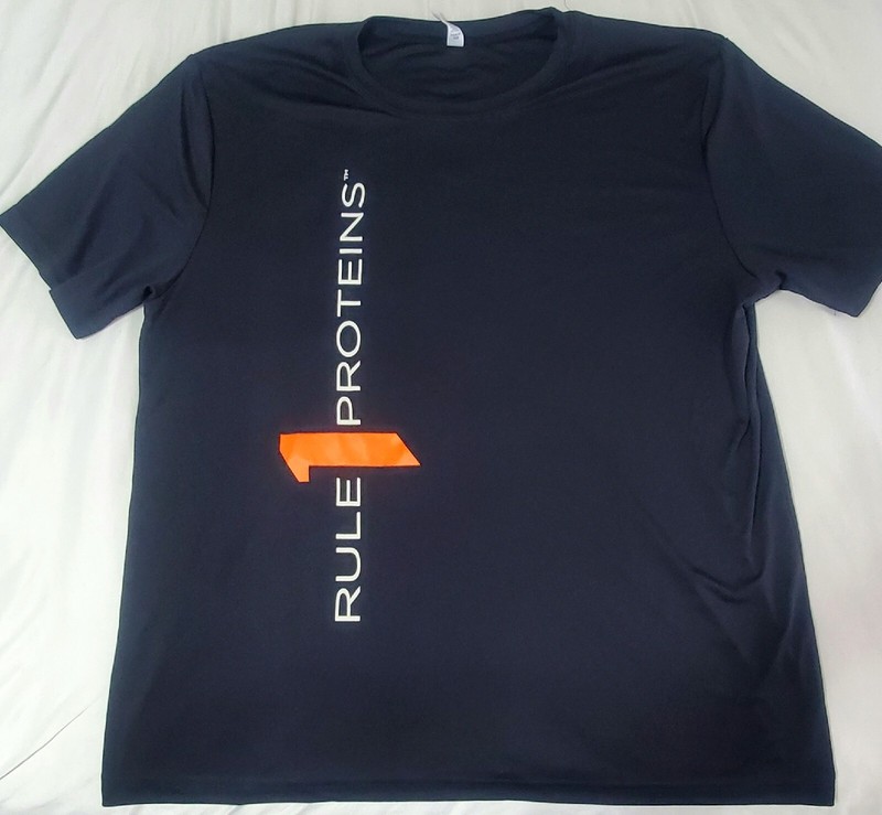 RULE 1 PROTEINS ARNOLD EXPO T-SHIRT MENS SIZE XL BLACK POLYESTER NEW UNWORN