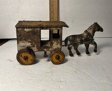 Marx tin lithographed horse-drawnToyland Farm Products wagon.