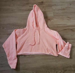 peach colored sweatshirt