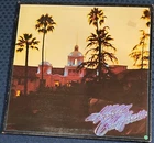 THE EAGLES Hotel California 1976 Asylum 7ES 1084 w/ POSTER Canada 1st plays NM