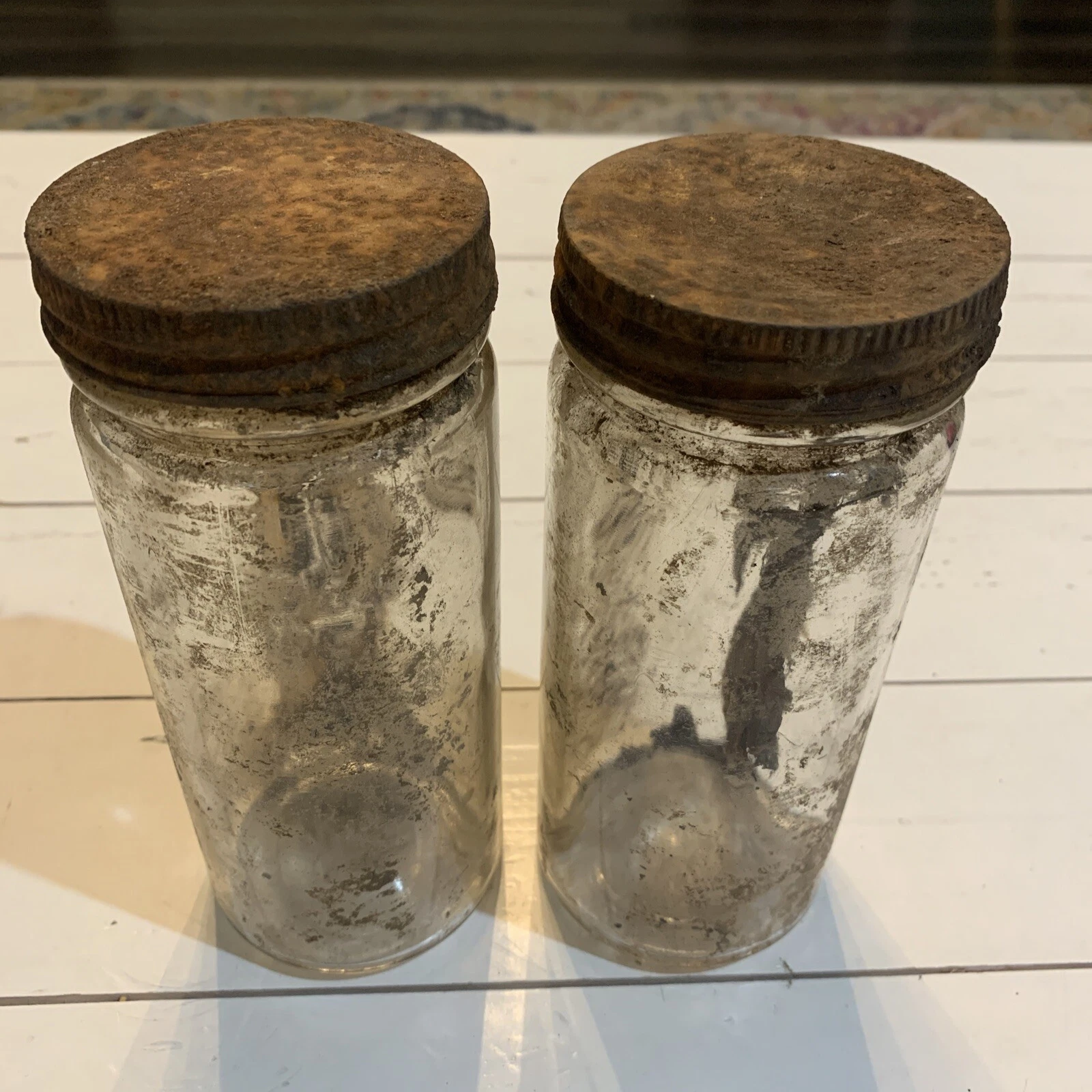 vintage glass jars metal lids found in Colorado mine