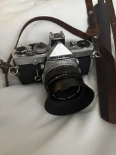 Olympus OM-1N 35mm SLR Film Camera + Zuiko 50mm f/1.8 Lens + Hood –