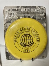 Wham-O FRISBEE WORLD CLASS FRISBEE. 141 grams. 1975. Yellow With Gold Foil.