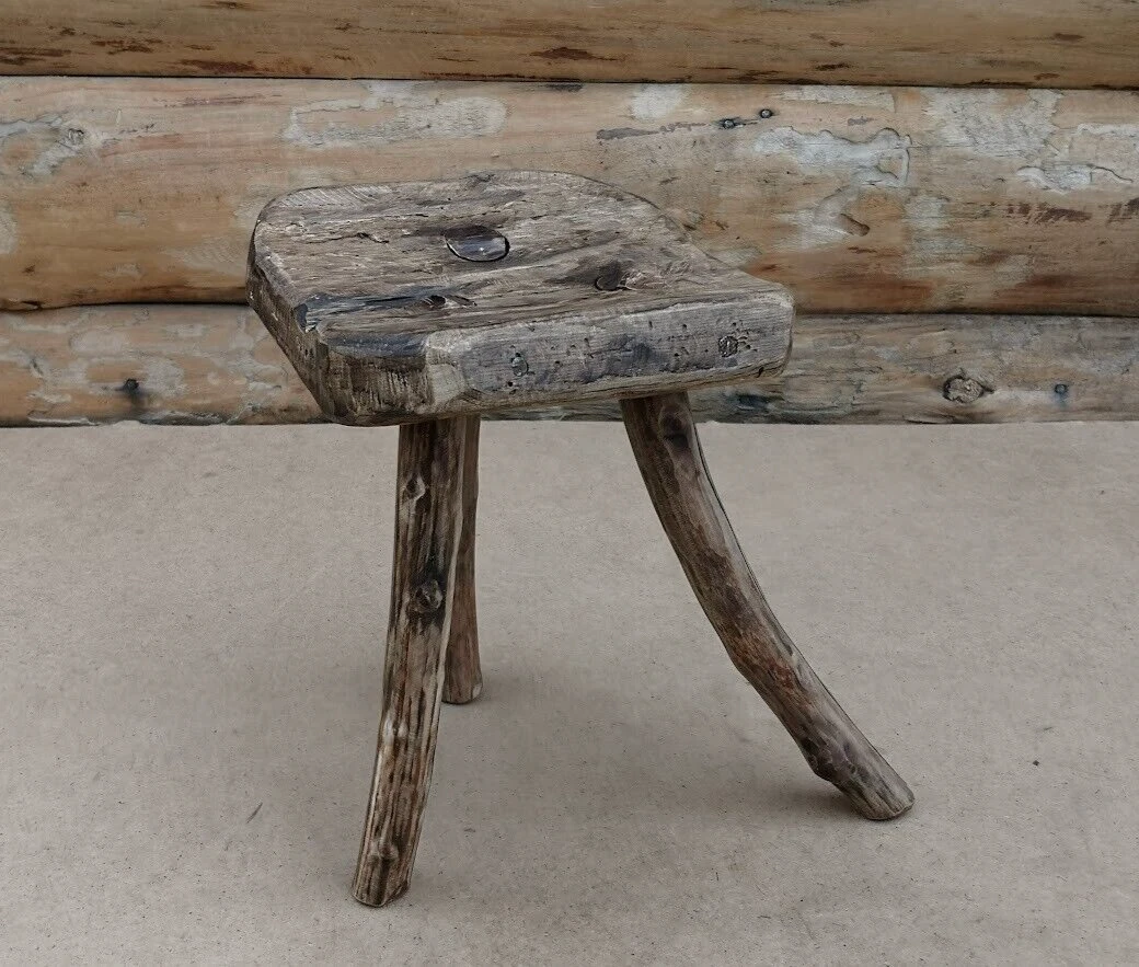 Small wooden outlet milking stool