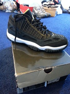jordan 11 black yellow