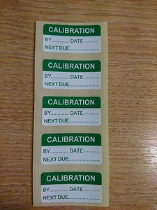 Self adhesive calibration labels