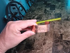 handmade copper bracelet "HABEAS CORPUS" stamped on it .