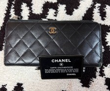 Auténtica billetera larga de cuero negra matelasse negra con cremallera redonda de piel de cordero Chanel CoCo Mark