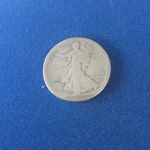 1916 Walking Liberty Half Dollar having AG details.