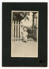 Antique Photo - Cute Baby Standing Outside - Hand on a Fence 