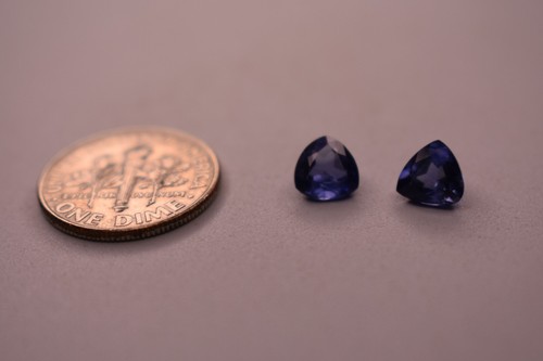 A matching pair of 1.25 Ct. Trillion Cut Natural Blue Sapphires.