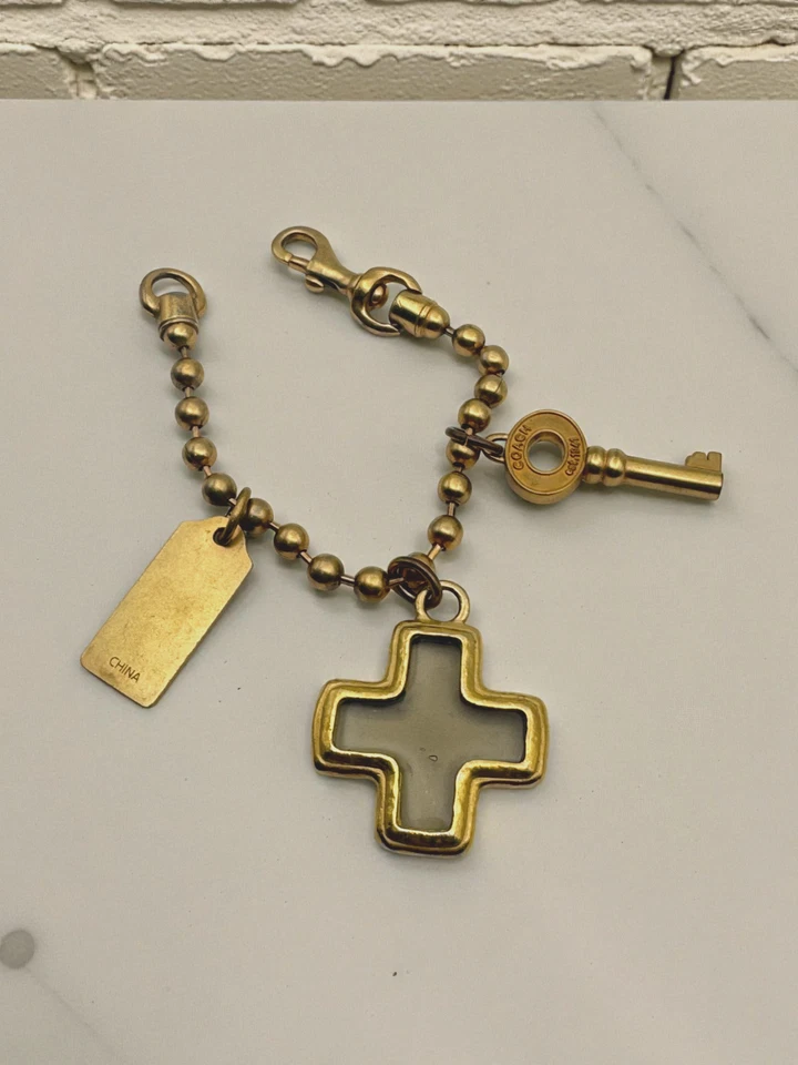 Pulsera Coach Vintage Gruesa Cadena Bola Oro Cruz Llave Colgante Multi Dije Y2K Foto 2 de 4