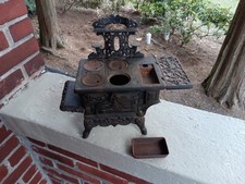 VINTAGE CRESCENT CAST IRON MINIATURE STOVE TOY