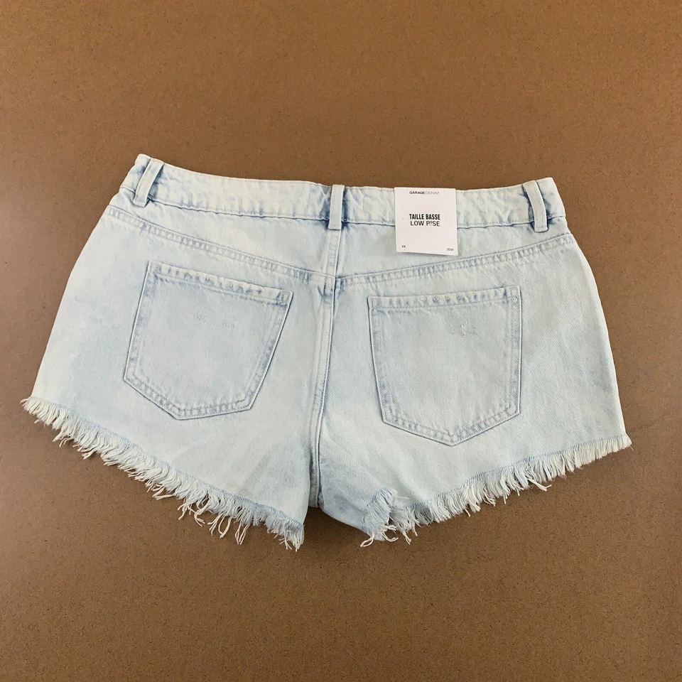 Pantalones Cortos de Jean Garage Denim Juniors Talla 11 Lavado Ligero Rasgados Tiro Bajo Cortados Nuevos con Etiquetas Foto 4 de 4