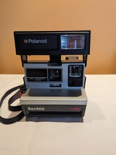 VINTAGE SUN 600 LMS POLAROID CAMERA NO FILM NOT TESTED APPEARS TO WORK HAS STRAP