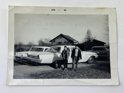 Vintage Black and White Picture of 2 Boys Standing w/ Old Cars And a Barn 1966