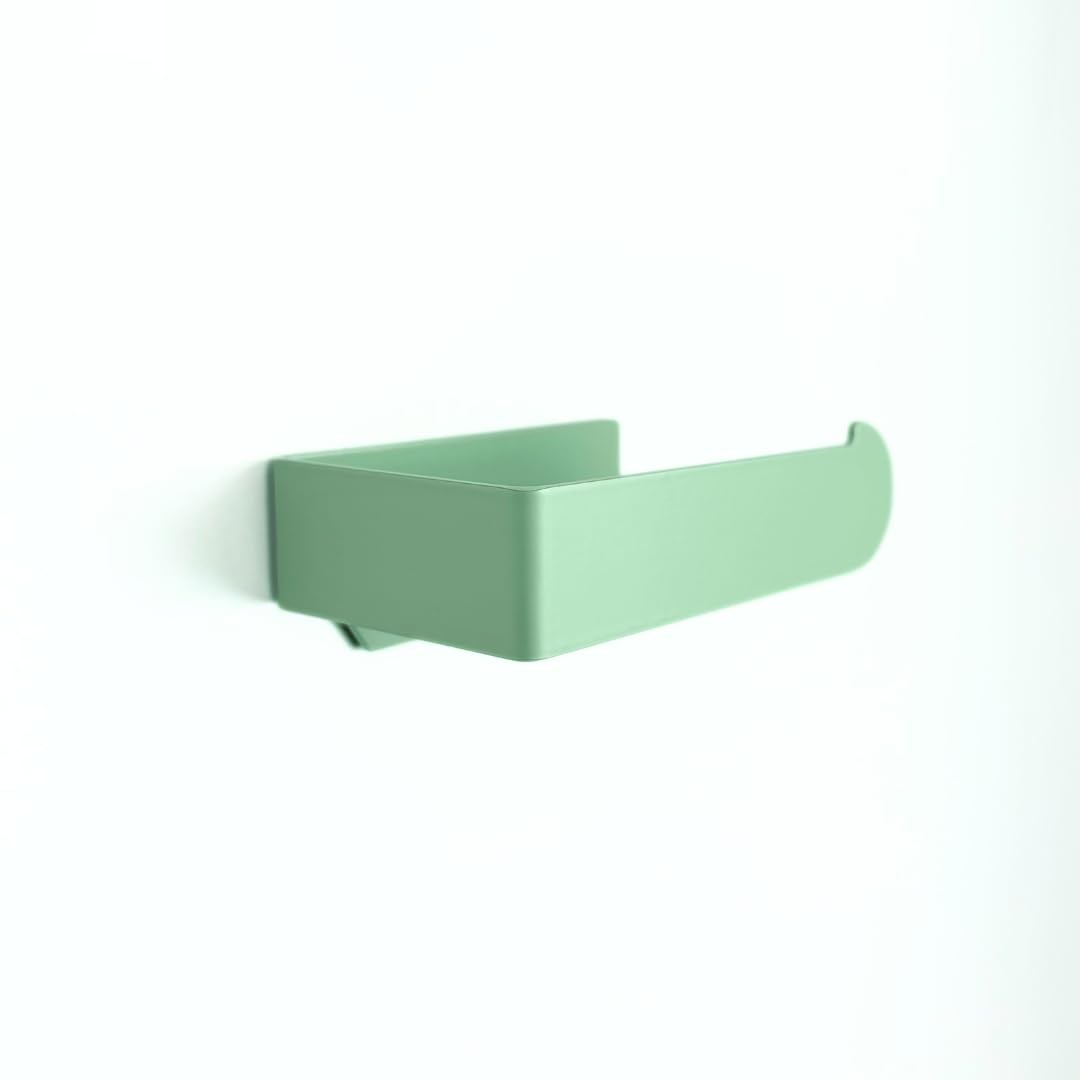 Porte-papier toilette vert suspendu pour une décoration de salle de bain nature