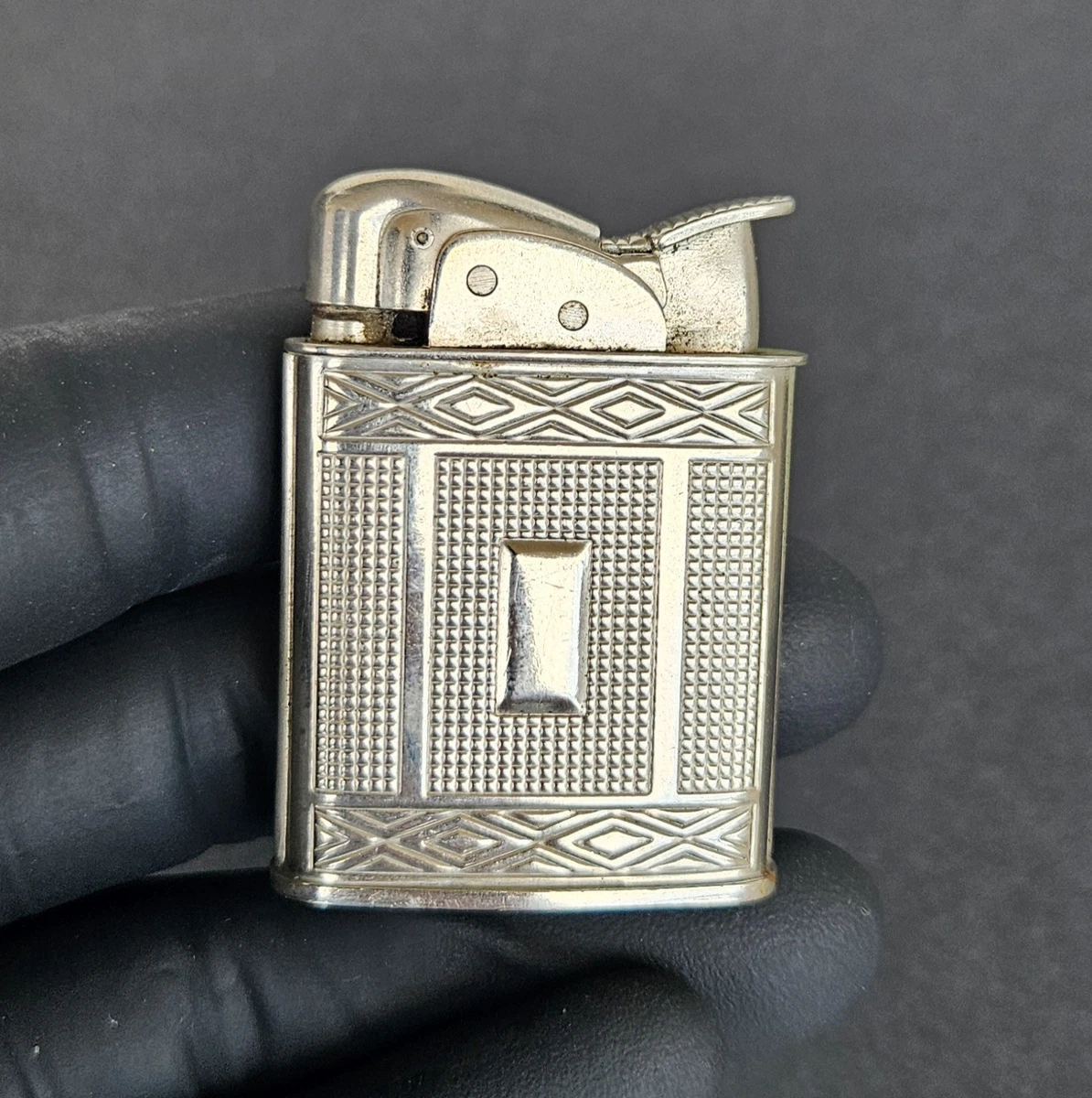 art deco cigarette lighter 233: GERMAN, with watch < Treasures: Objects from the Capstick-Dale Collection, 5 June 2024 < Auctions Featuring a striking flame motif Sold at Auction: Vintage Art
