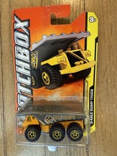 New 2012 Matchbox 3-Axle Dump Truck Yellow 37/120 Max Construction