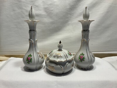 Two Vintage perfume bottles with matching trinket box