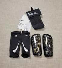 NIKE Mercurial Flylite SuperLock Shin Guard Large Unisex Adult Black Gold Soccer