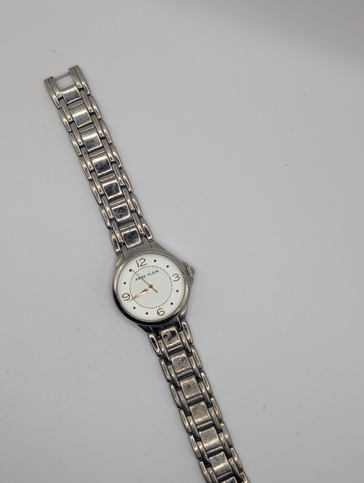 Anne Klein Women's Silver Tone Quartz Watch White Dial Gold Tone Arabic Numerals