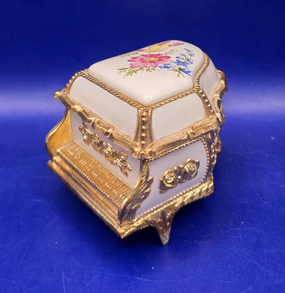 Tiny Made-in-Japan MELE piano jewelry box with butterfly and floral detail — a sweet, still-working piece of mid-century charm.