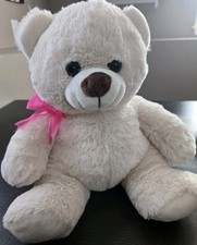 plush 10" Tall Cream Colored teddy bear with a pink bow