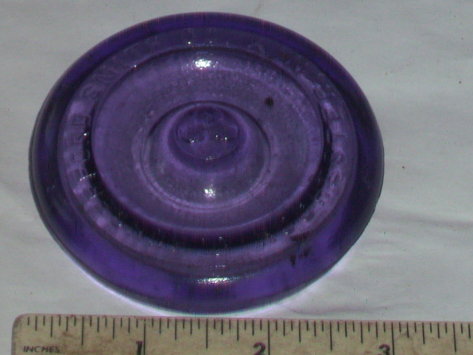 Dark purple J, Hungerford Smith co. Rochester, N. Y. glass top canning jar lid