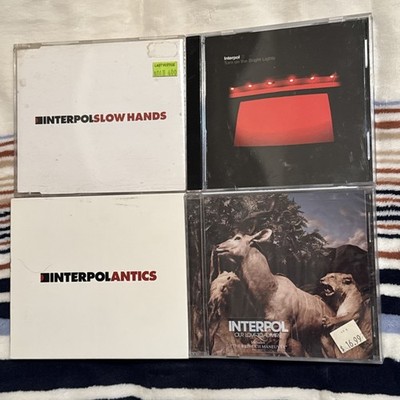 Lot of 2 CDs by Interpol: Turn on the Bright Lights + Our Love to Admire
