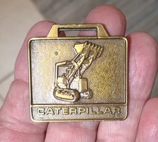 Vintage "CATERPILLAR" ROAD EQUIPMENT "HIGH LOADER WATCH FOB