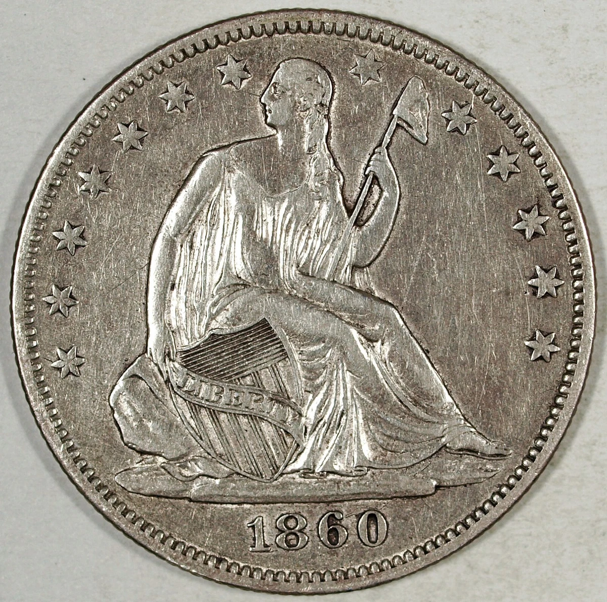 1860 Year Silver Seated Liberty US Half Dollars (1839-1891) for
