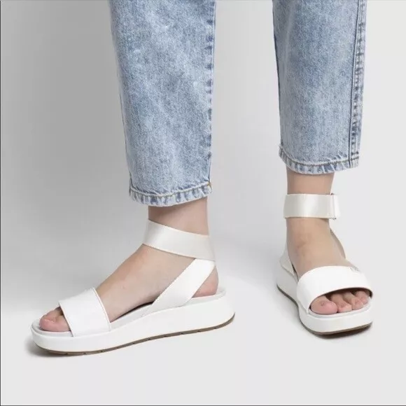 UGG LENNOX Women s Size 9.5M White Faux Patent Leather Ankle Wrap