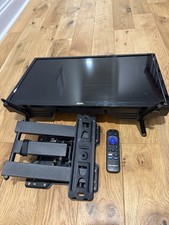 24 In. Onn built in Roku TV WITH MOUNT AND REMOTE - Lost screws for mount.